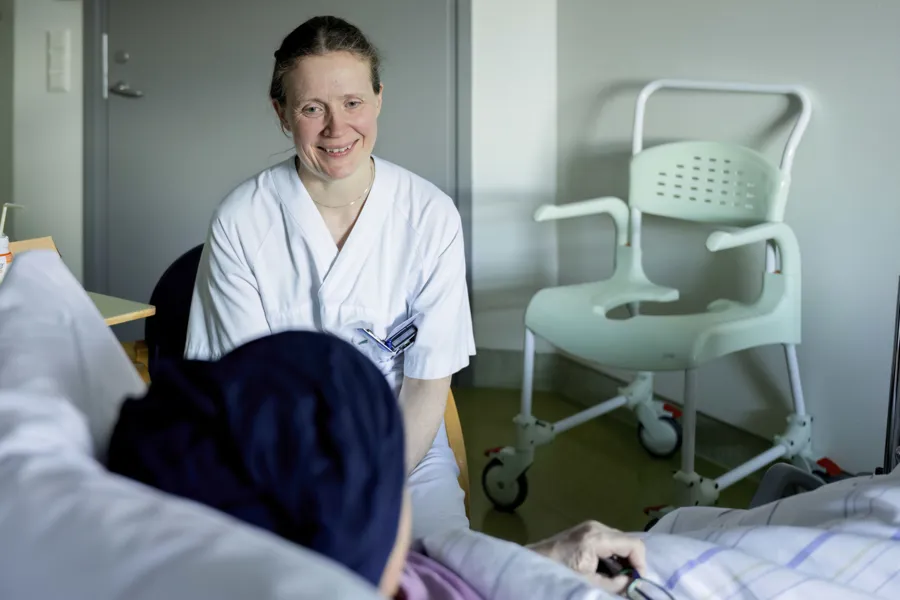 A doctor in a hospital bed